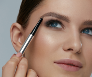 model applying brow pencil 