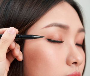 person applying eyeliner
